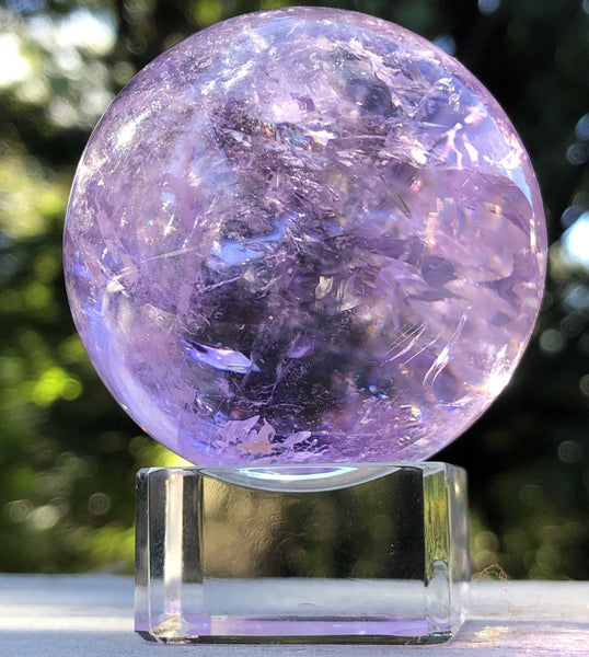Clear glass sphere stand